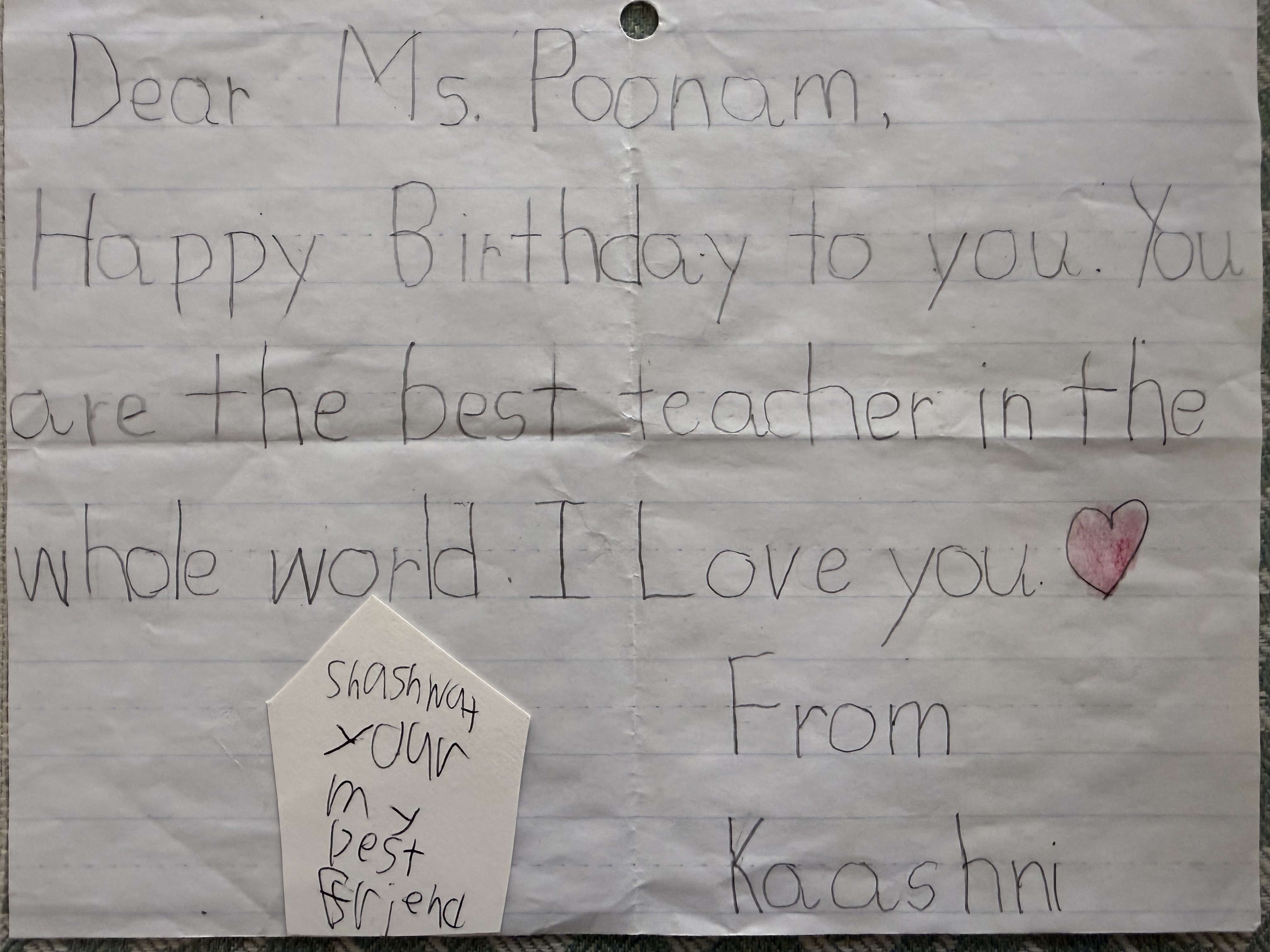 Child drawing and note from a NurtureNest student